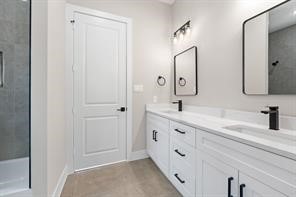 2615 Piemonte Avenue Cir Spring Spring, TX 77388 - Photo 9 of 21 a spacious bathroom with double vanity sink and a mirror