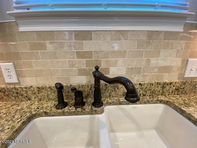 581 River Ridge Road, Unit 4 Shallotte, NC 28470 - Photo 13 of 50 Upgraded plumbing fixtures and custom backsplash