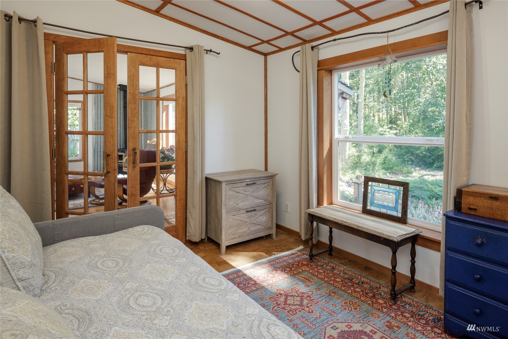 268 Wren Road Lopez Island, WA 98261 - Photo 13 of 23 a bedroom with furniture and a window