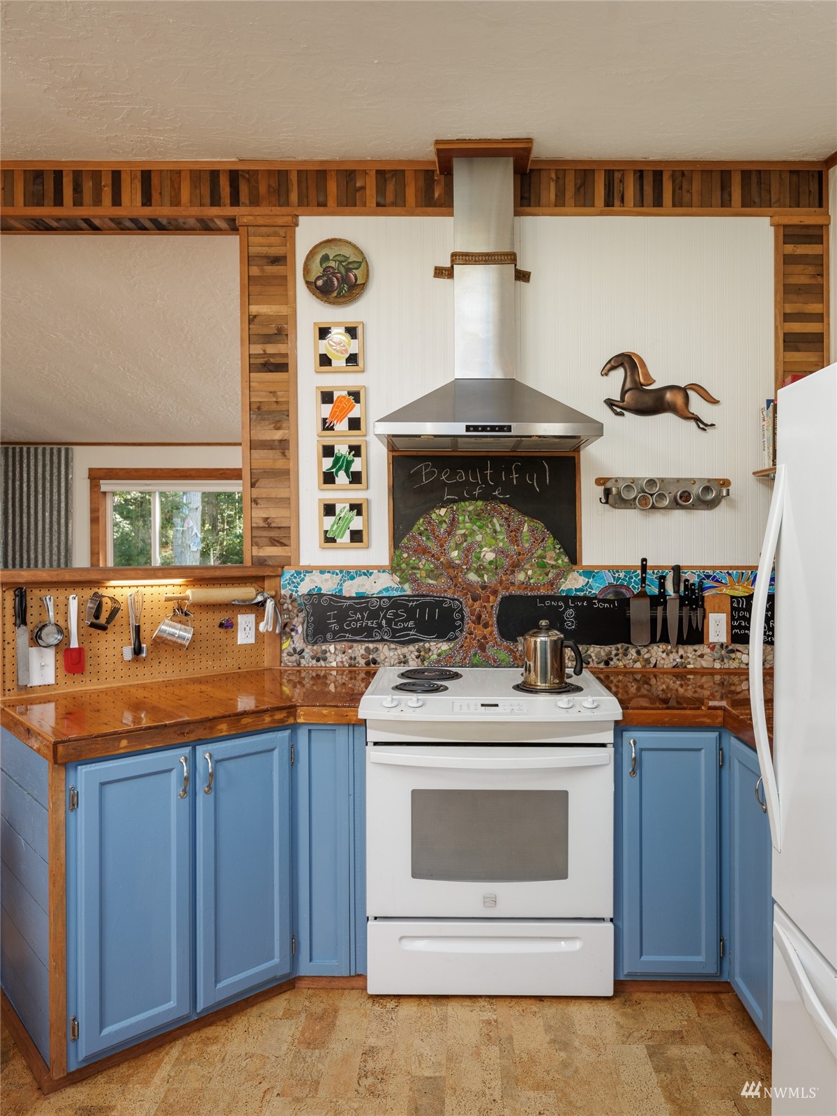 268 Wren Road Lopez Island, WA 98261 - Photo 8 of 23 a kitchen with stainless steel appliances a stove and more cabinets