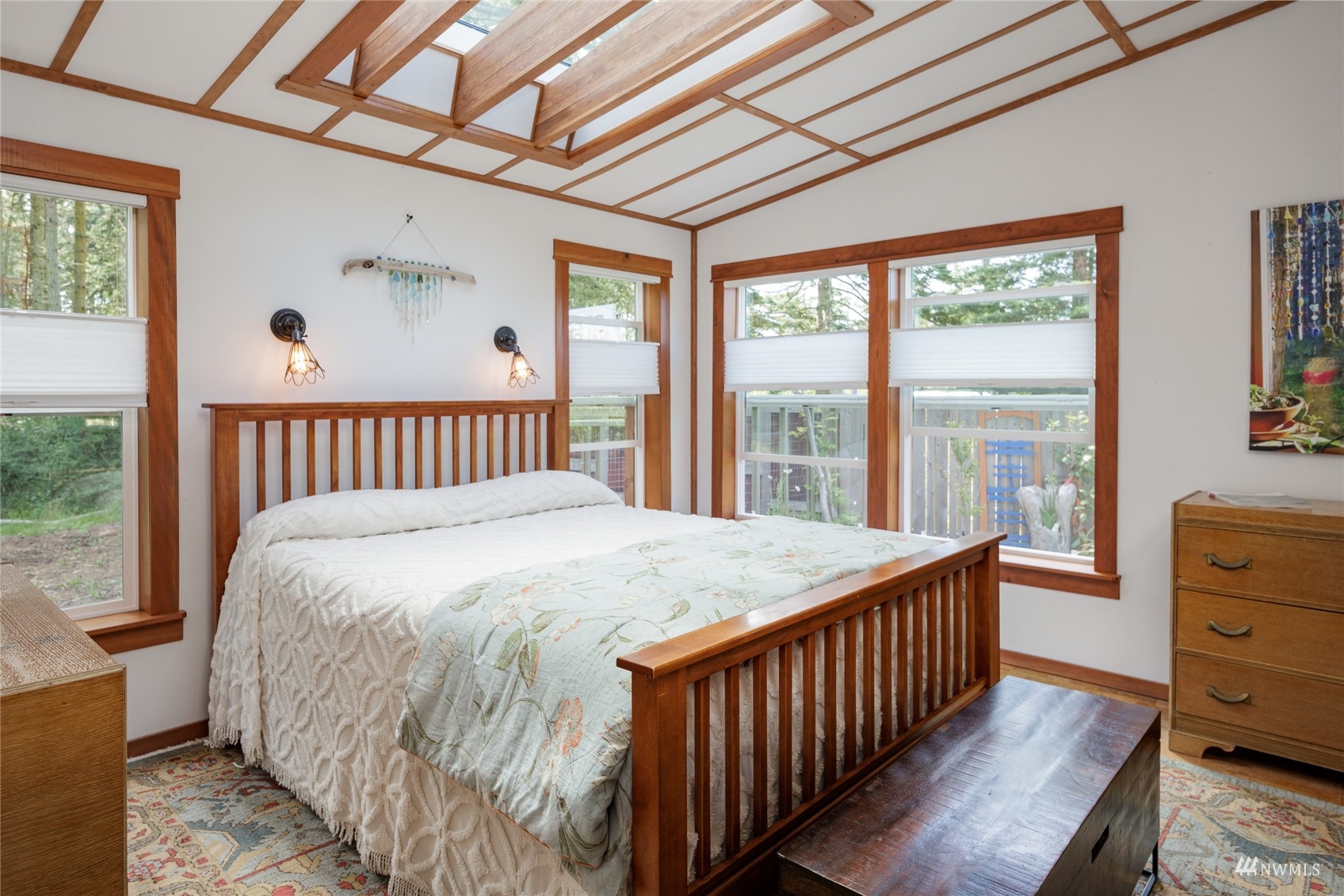268 Wren Road Lopez Island, WA 98261 - Photo 9 of 23 a bed sitting in a bedroom next to a window