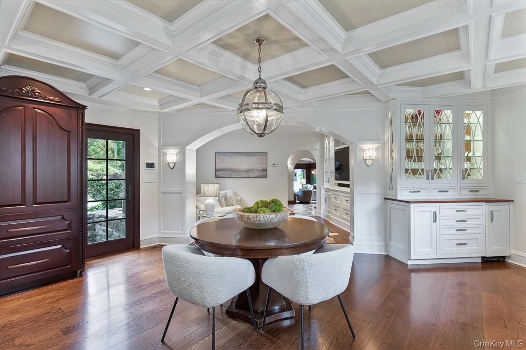 21 Hampshire Road Bronxville, NY 10708 - Photo 13 of 41 The luxurious kitchen adjoins the formal dining room and features a breakfast area, butler's pantry, coffered ceilings and top of the line appliances that are concealed behind beautiful panelling. View of the open kitchen with breakfast area also showcases the family room.