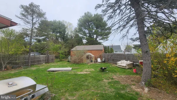 a view of backyard with a garden and plants