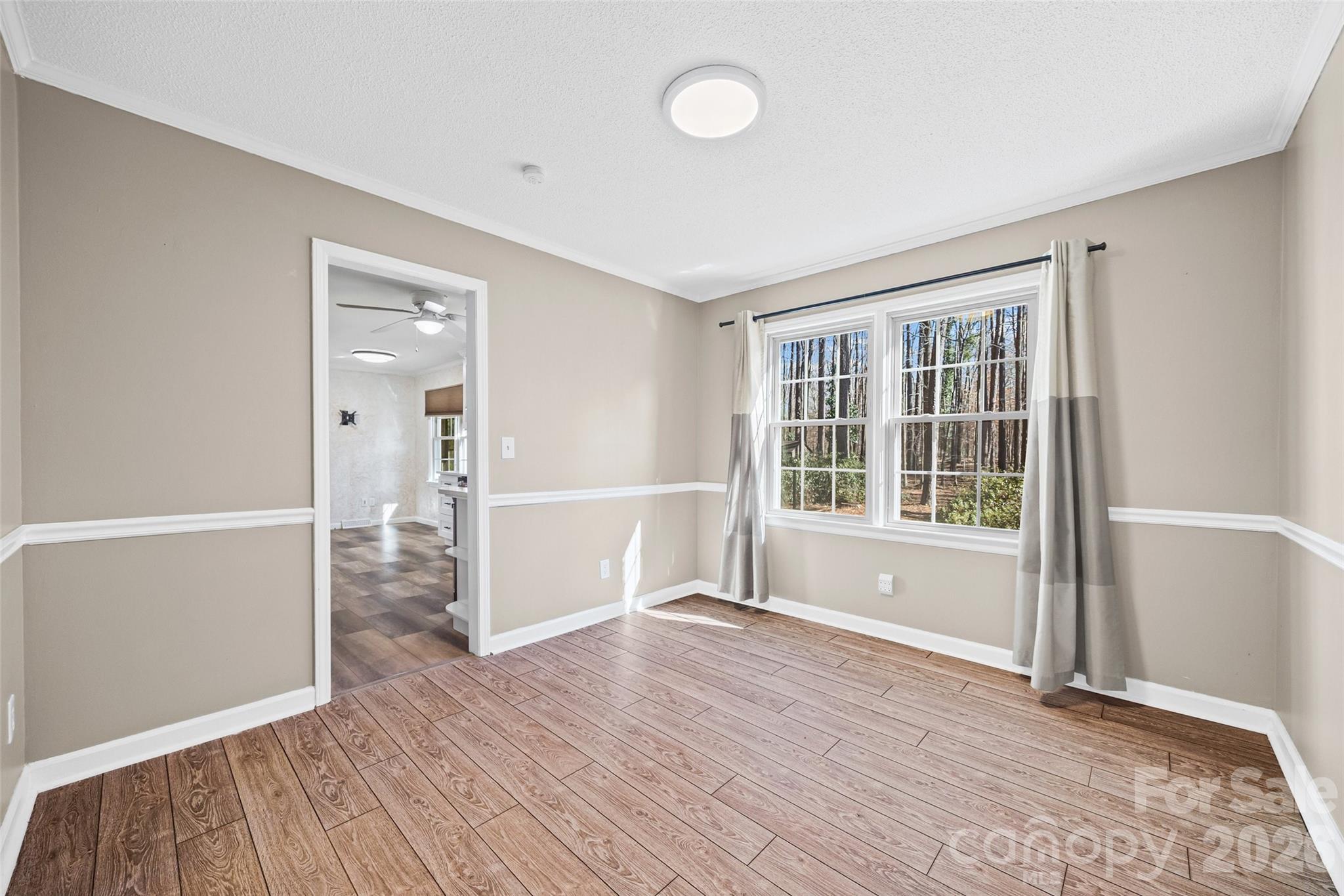 405 Bratton Avenue York, SC 29745 - Photo 15 of 43 a view of empty room with wooden floor and fan