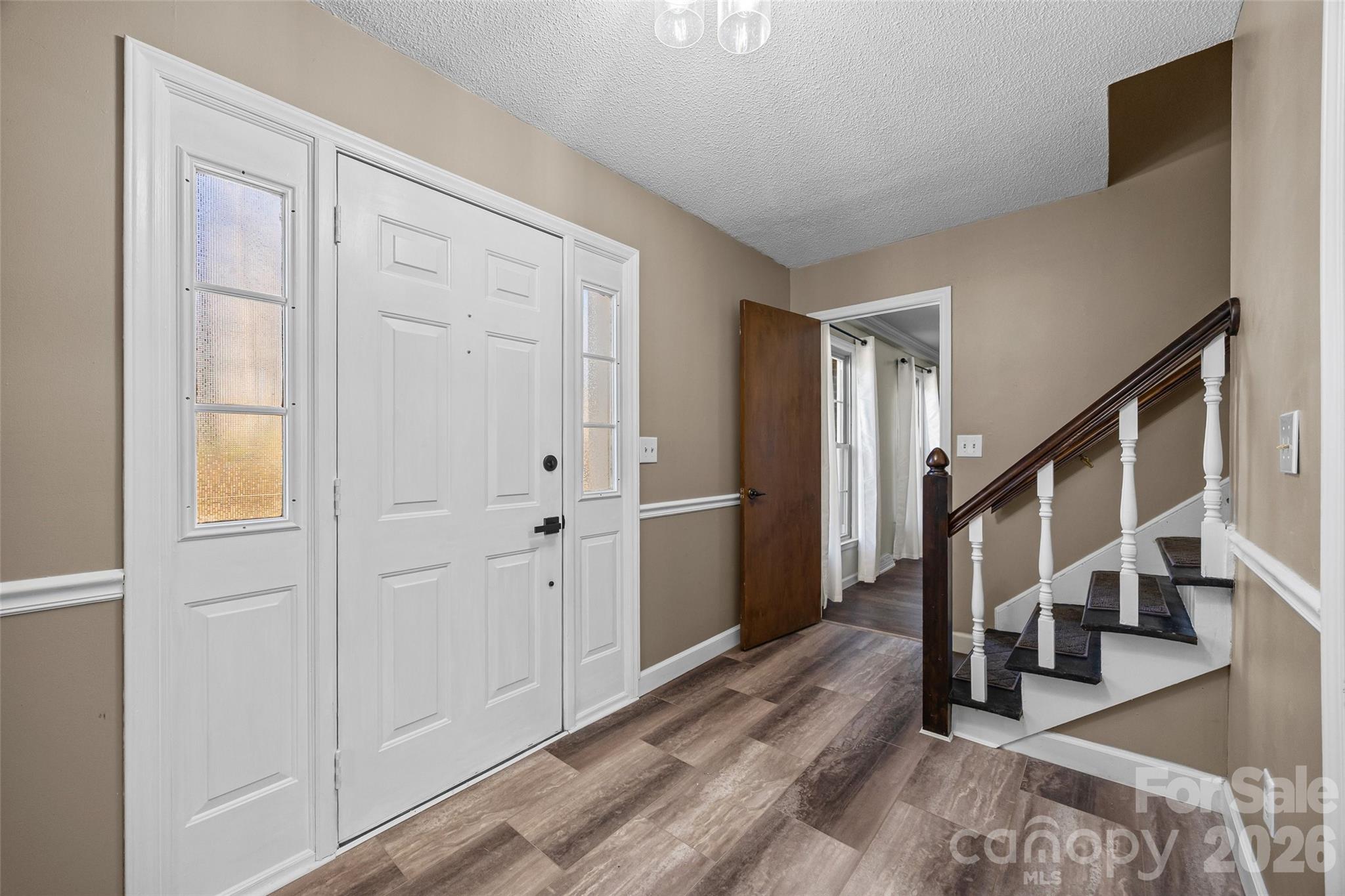 405 Bratton Avenue York, SC 29745 - Photo 3 of 43 a view of entryway with wooden floor and stairs