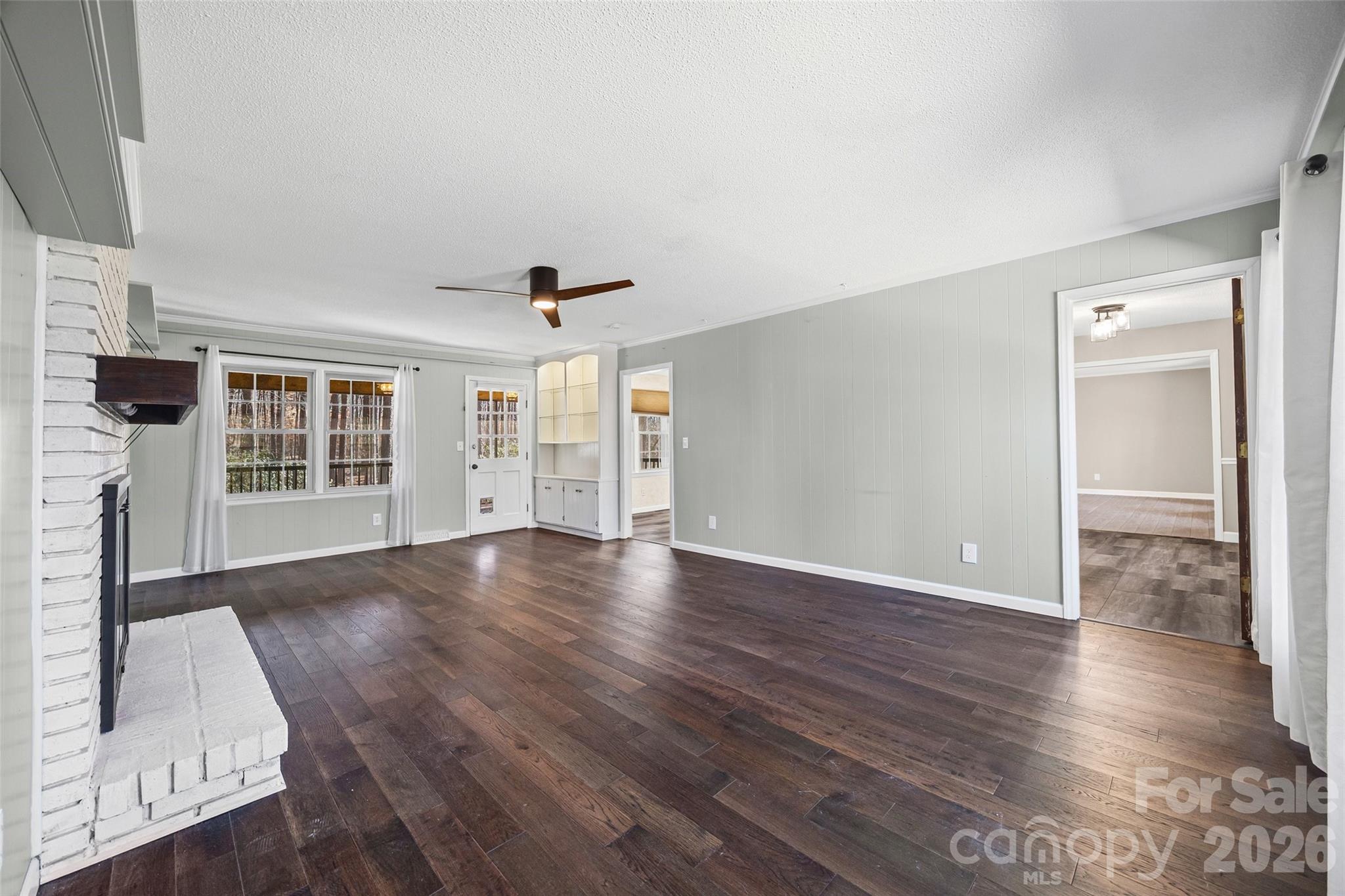 405 Bratton Avenue York, SC 29745 - Photo 6 of 43 a view of an empty room with wooden floor and a window