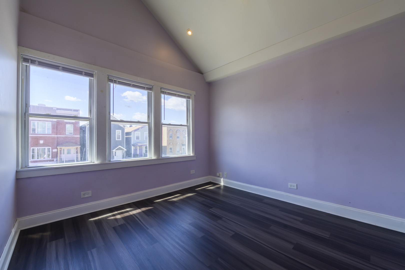 2436 West Fillmore Street Chicago, IL 60612 - Photo 19 of 44 a view of an empty room with wooden floor and a window