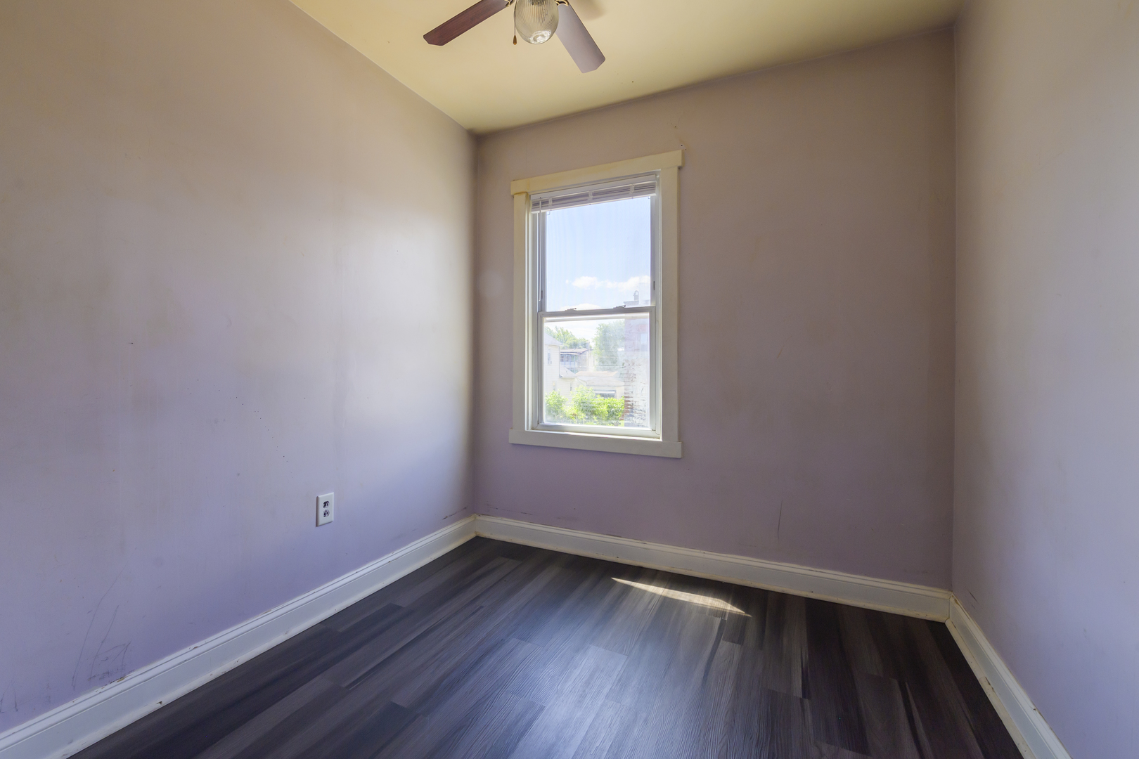 2436 West Fillmore Street Chicago, IL 60612 - Photo 22 of 44 a view of an empty room with wooden floor and a window
