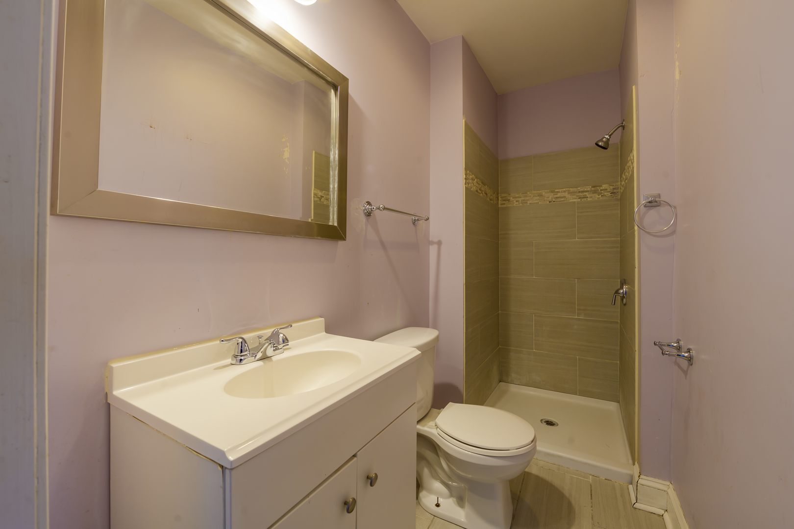 2436 West Fillmore Street Chicago, IL 60612 - Photo 23 of 44 a bathroom with a sink toilet and mirror