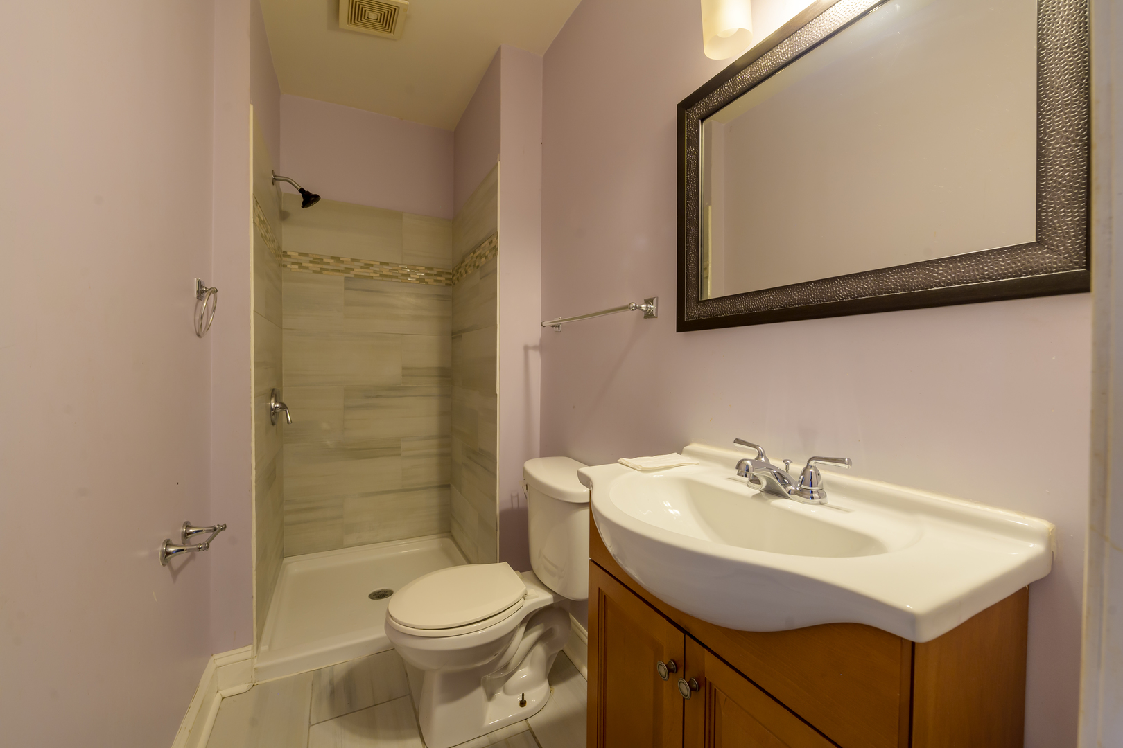 2436 West Fillmore Street Chicago, IL 60612 - Photo 24 of 44 a bathroom with a sink mirror toilet and shower