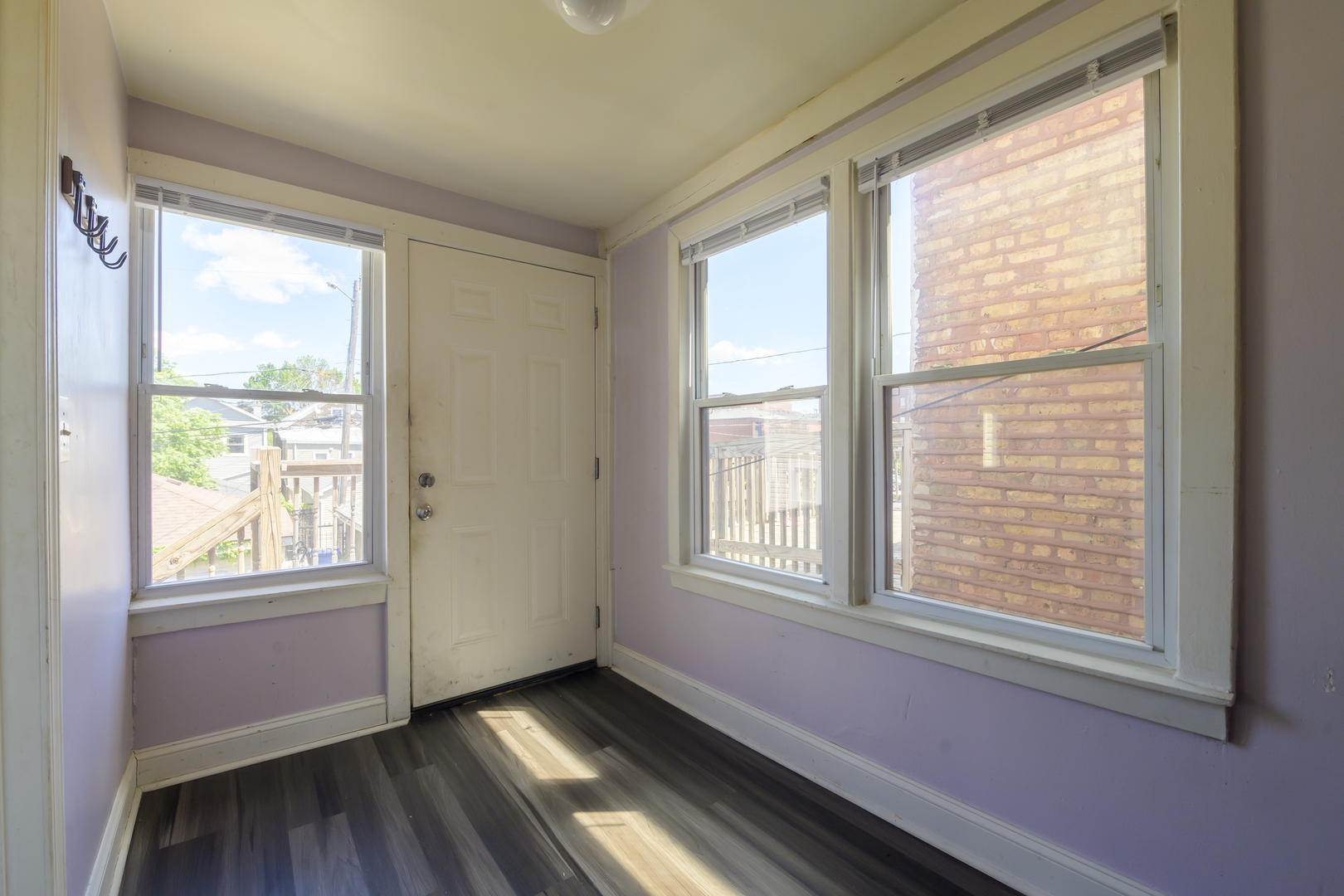 2436 West Fillmore Street Chicago, IL 60612 - Photo 30 of 44 a view of an empty room with wooden floor and a window