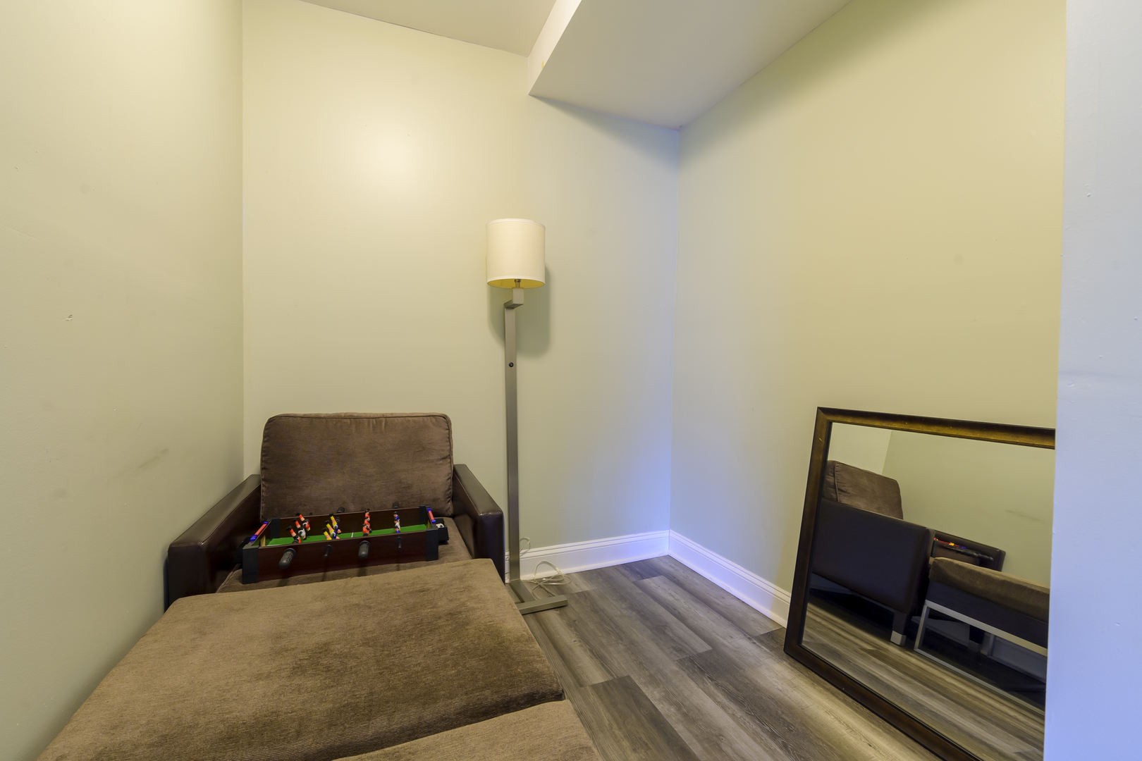 2436 West Fillmore Street Chicago, IL 60612 - Photo 3 of 44 a living room with a bed furniture and a mirror