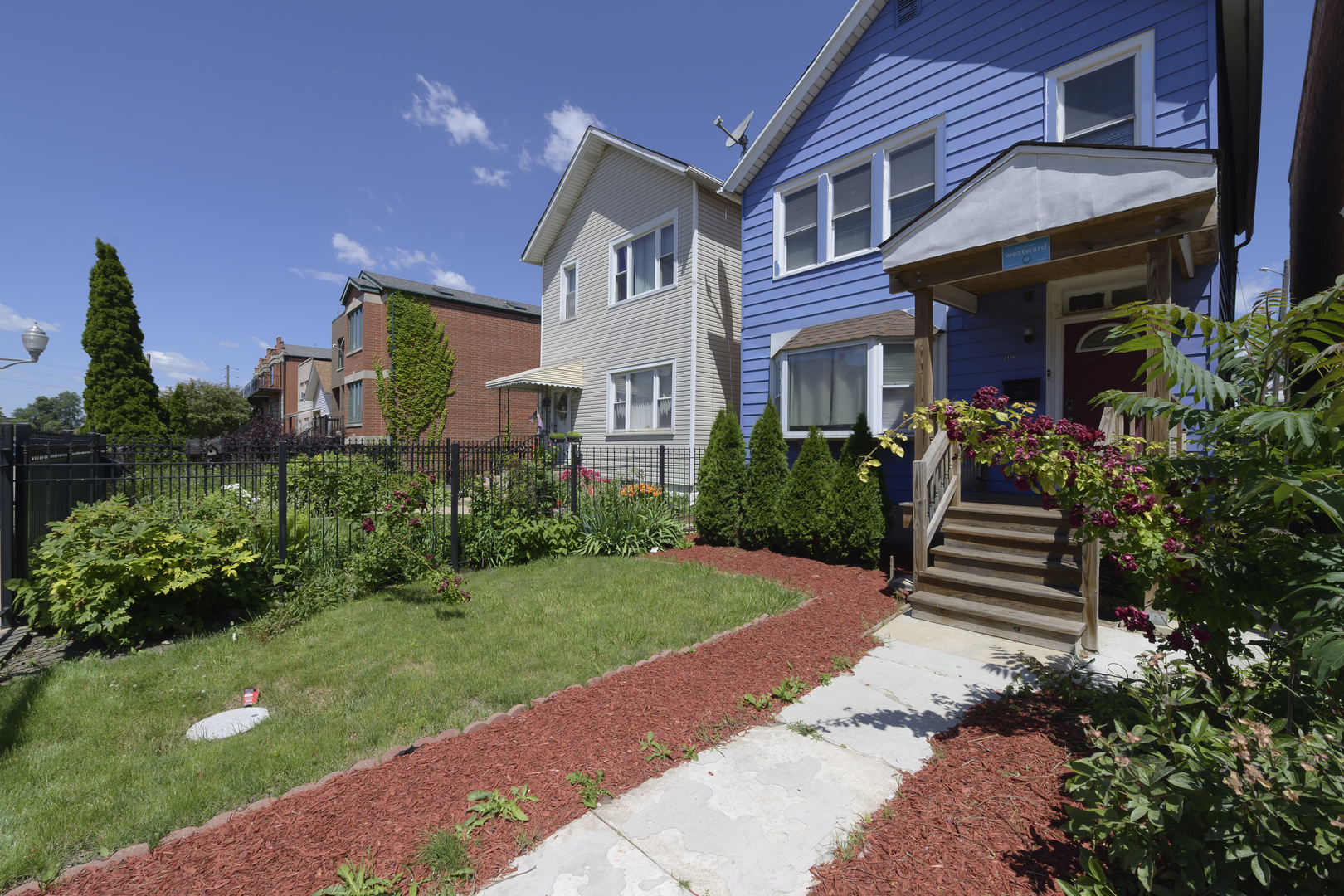 2436 West Fillmore Street Chicago, IL 60612 - Photo 40 of 44 a front view of a house with a garden