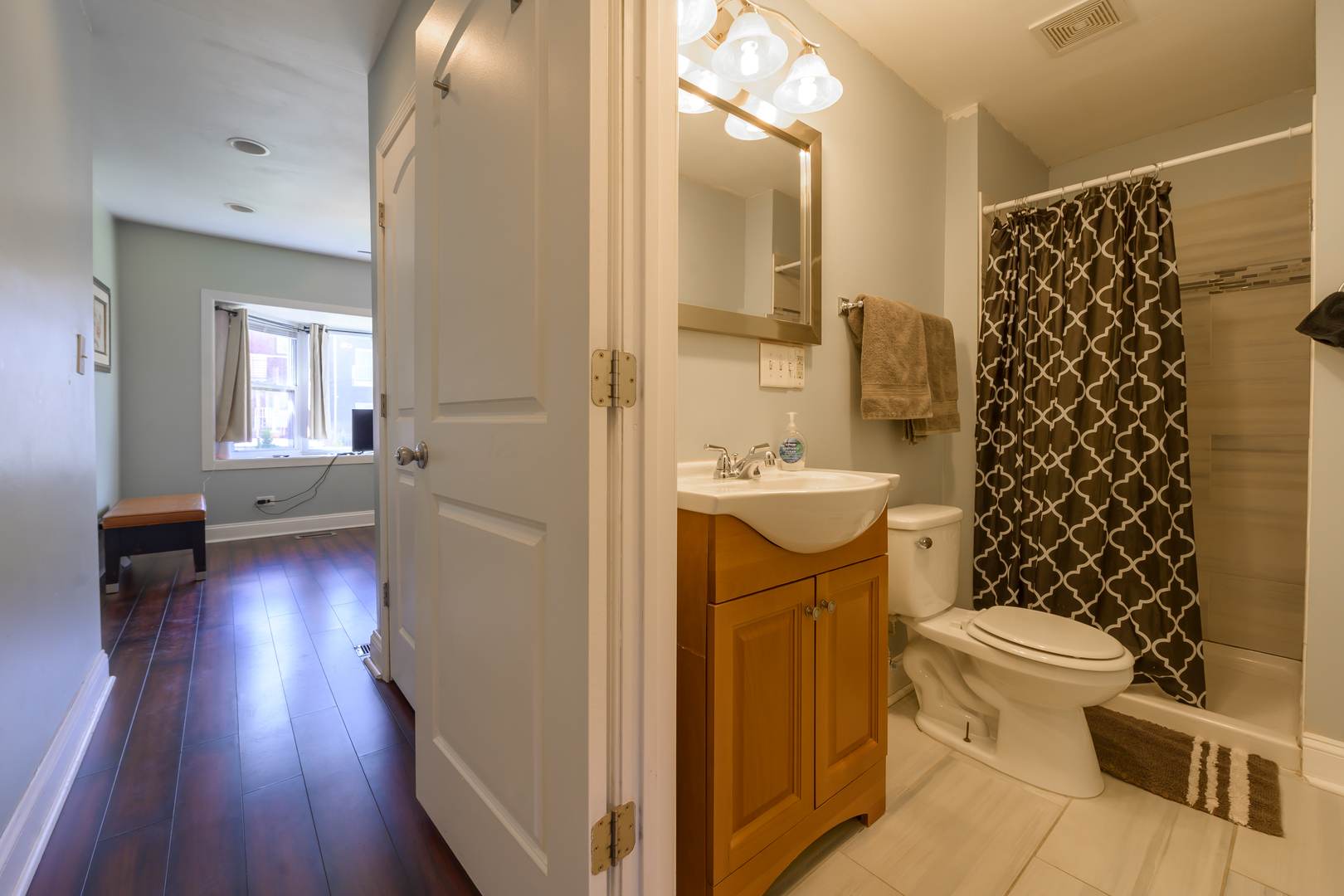 2436 West Fillmore Street Chicago, IL 60612 - Photo 10 of 44 a bathroom with a sink toilet and shower