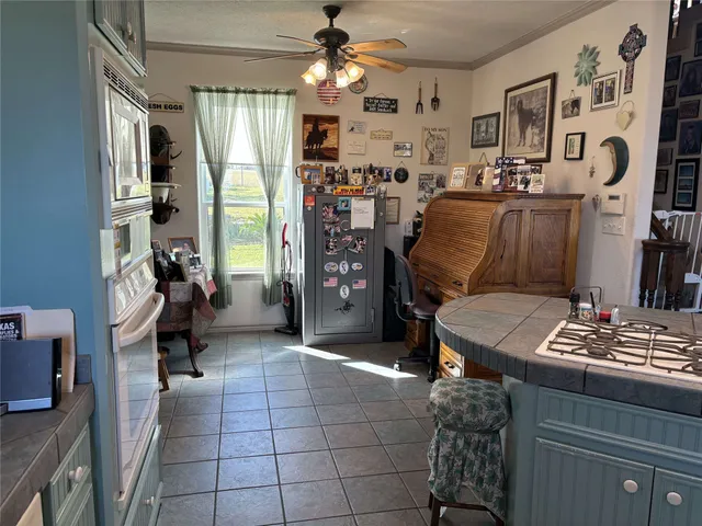 a view of staircase with white walls and a window