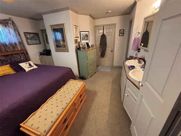 a bedroom with furniture and a wooden floor