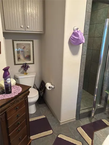 a kitchen with a refrigerator and a stove