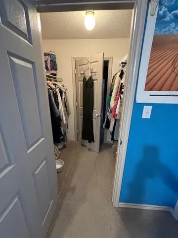 a living room with furniture a window and gym equipment