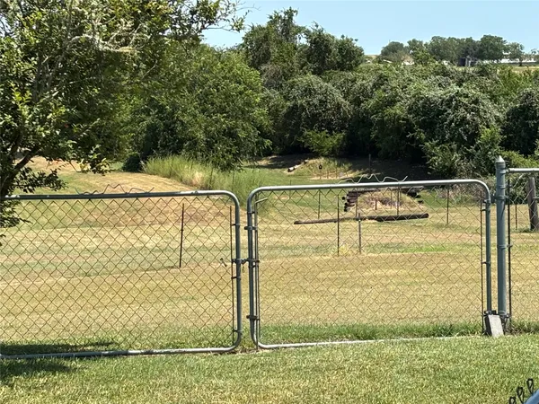 a view of a backyard of the house