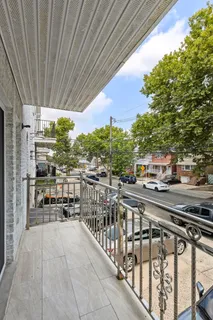 a view of a balcony with city view