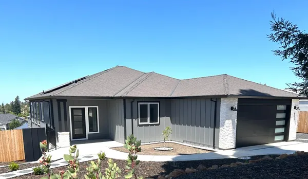 a front view of a house with a yard