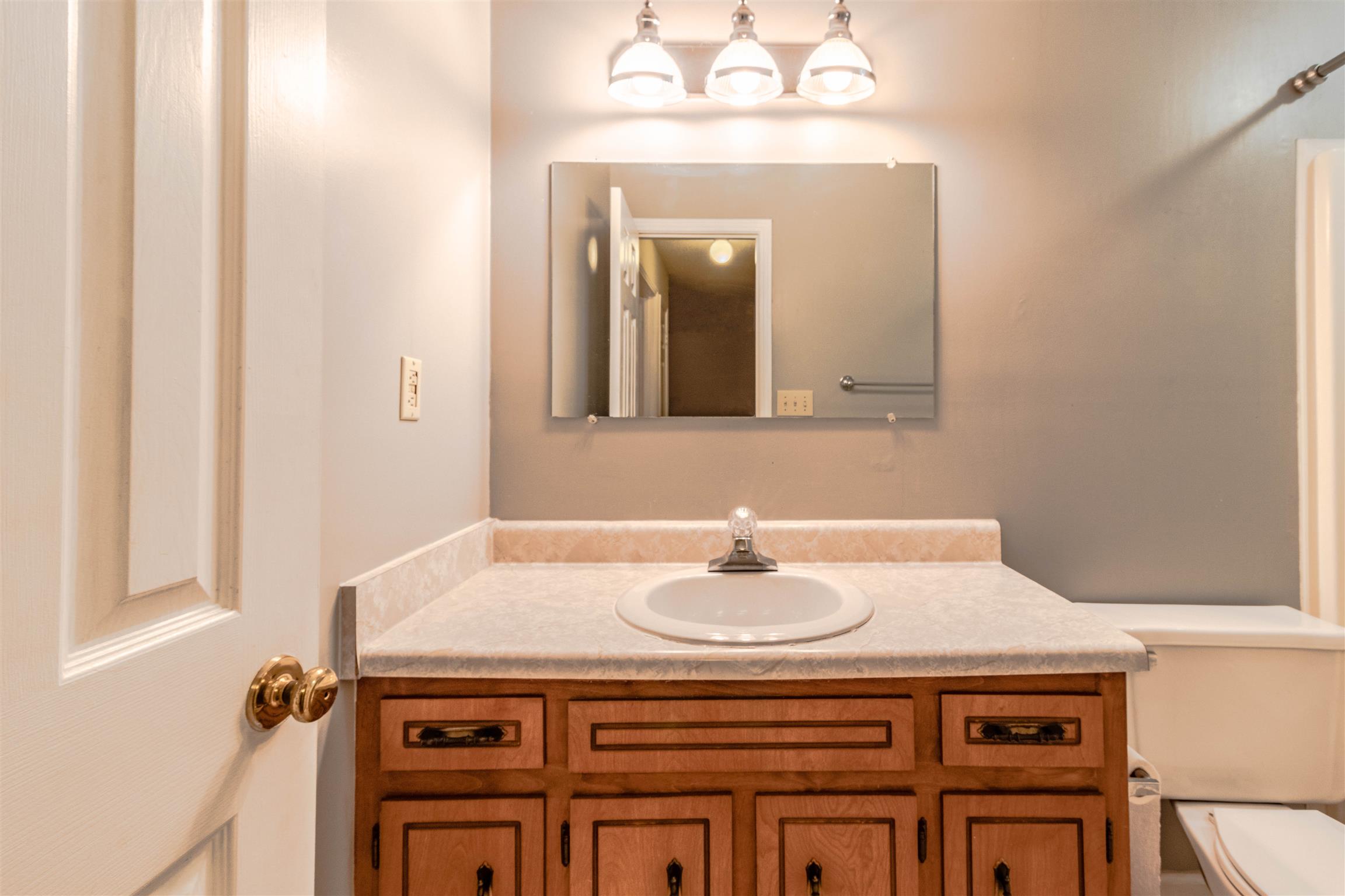 3411 Polly Drive Clarksville, TN 37042 - Photo 15 of 20 a bathroom with a sink and a mirror