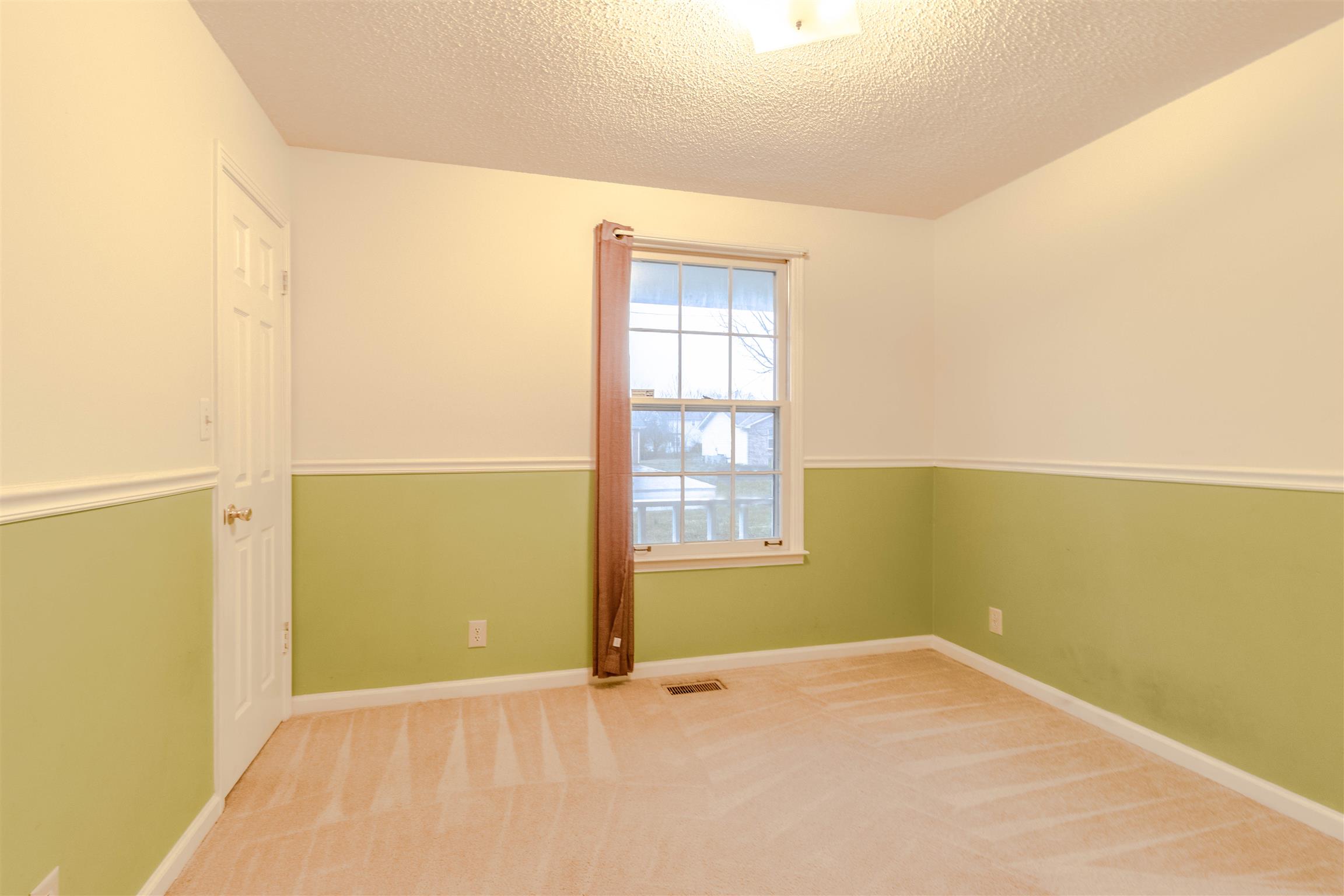 3411 Polly Drive Clarksville, TN 37042 - Photo 16 of 20 an empty room with a empty space and windows