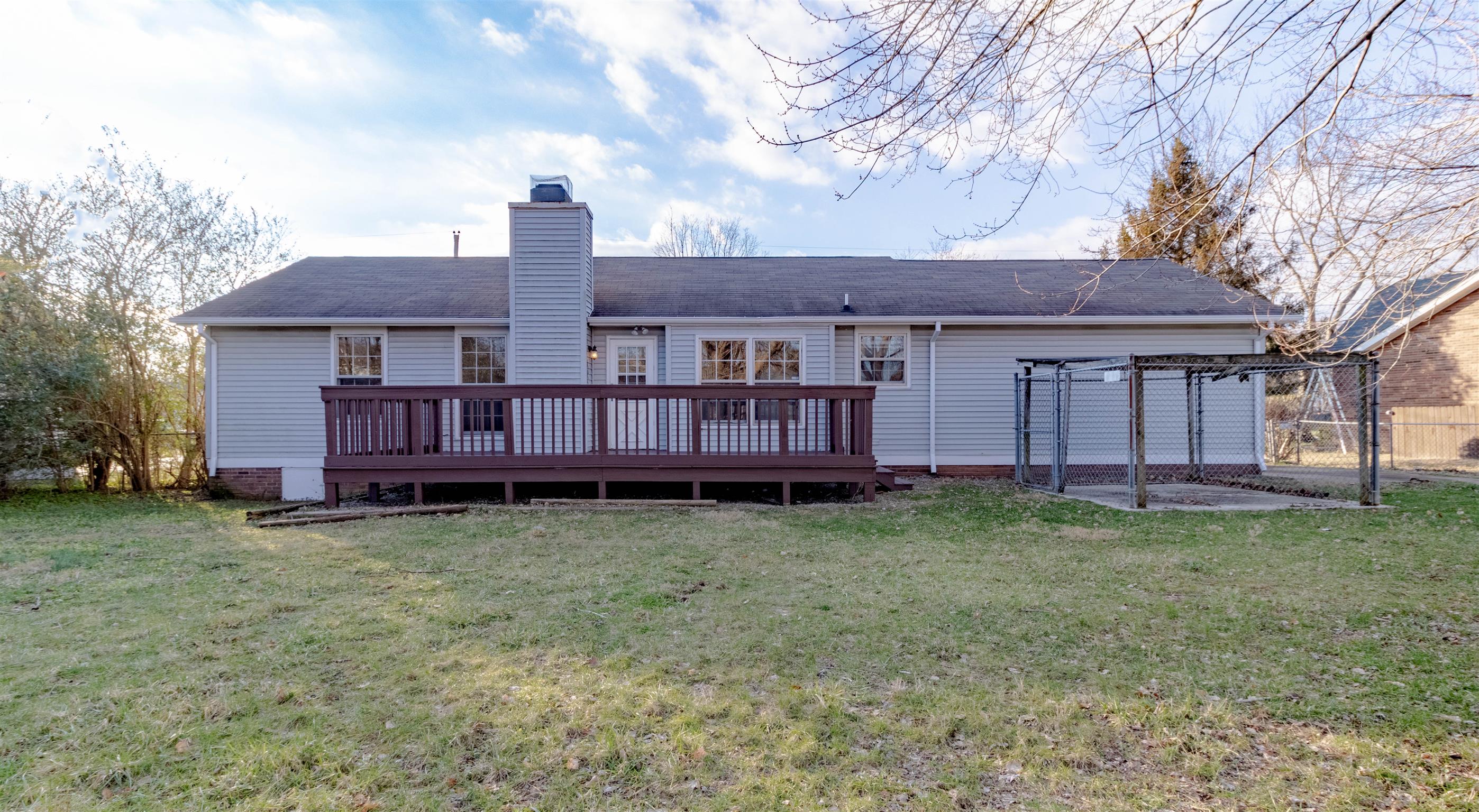 3411 Polly Drive Clarksville, TN 37042 - Photo 18 of 20 a view of a house with a yard and wooden fence