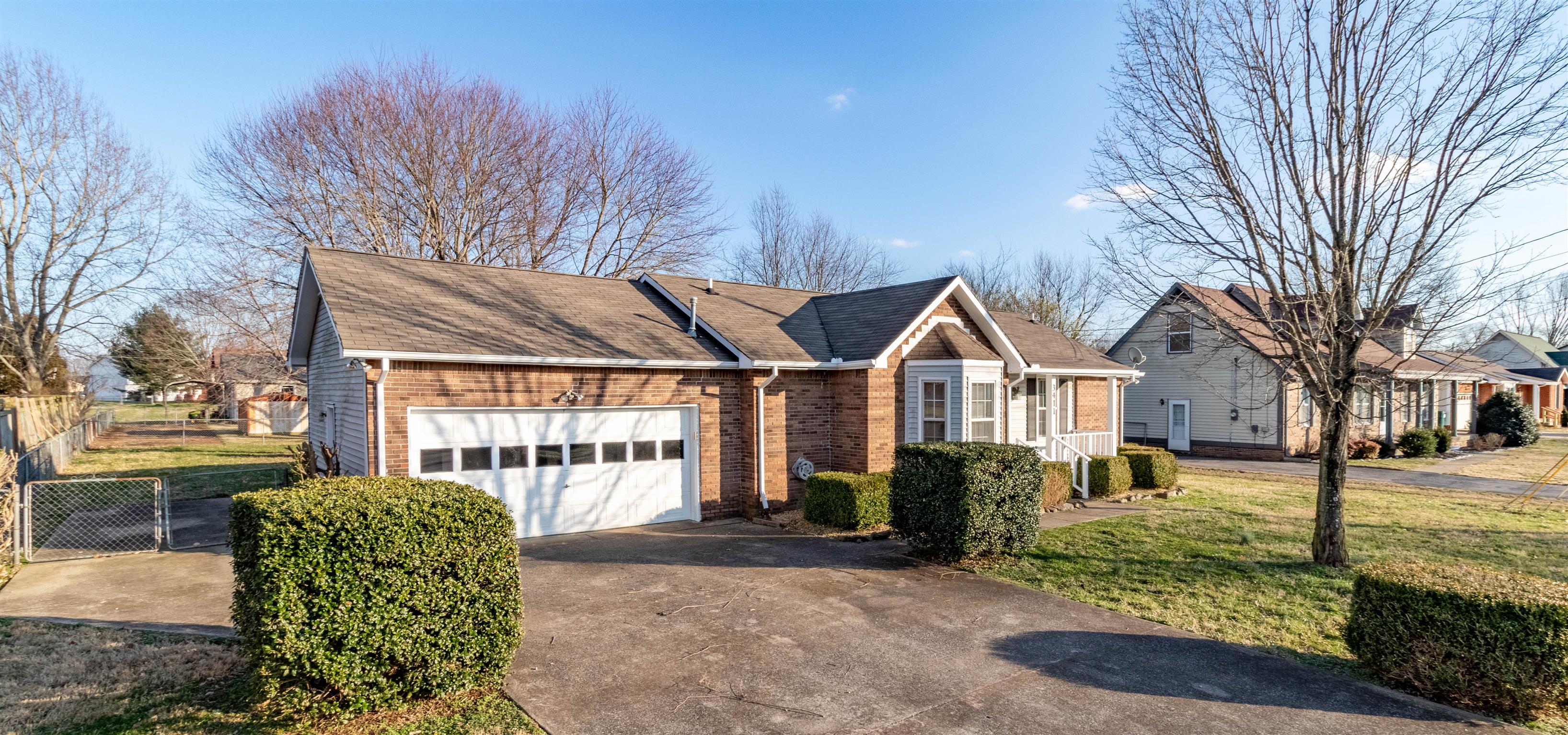 3411 Polly Drive Clarksville, TN 37042 - Photo 2 of 20 a front view of a house with garden