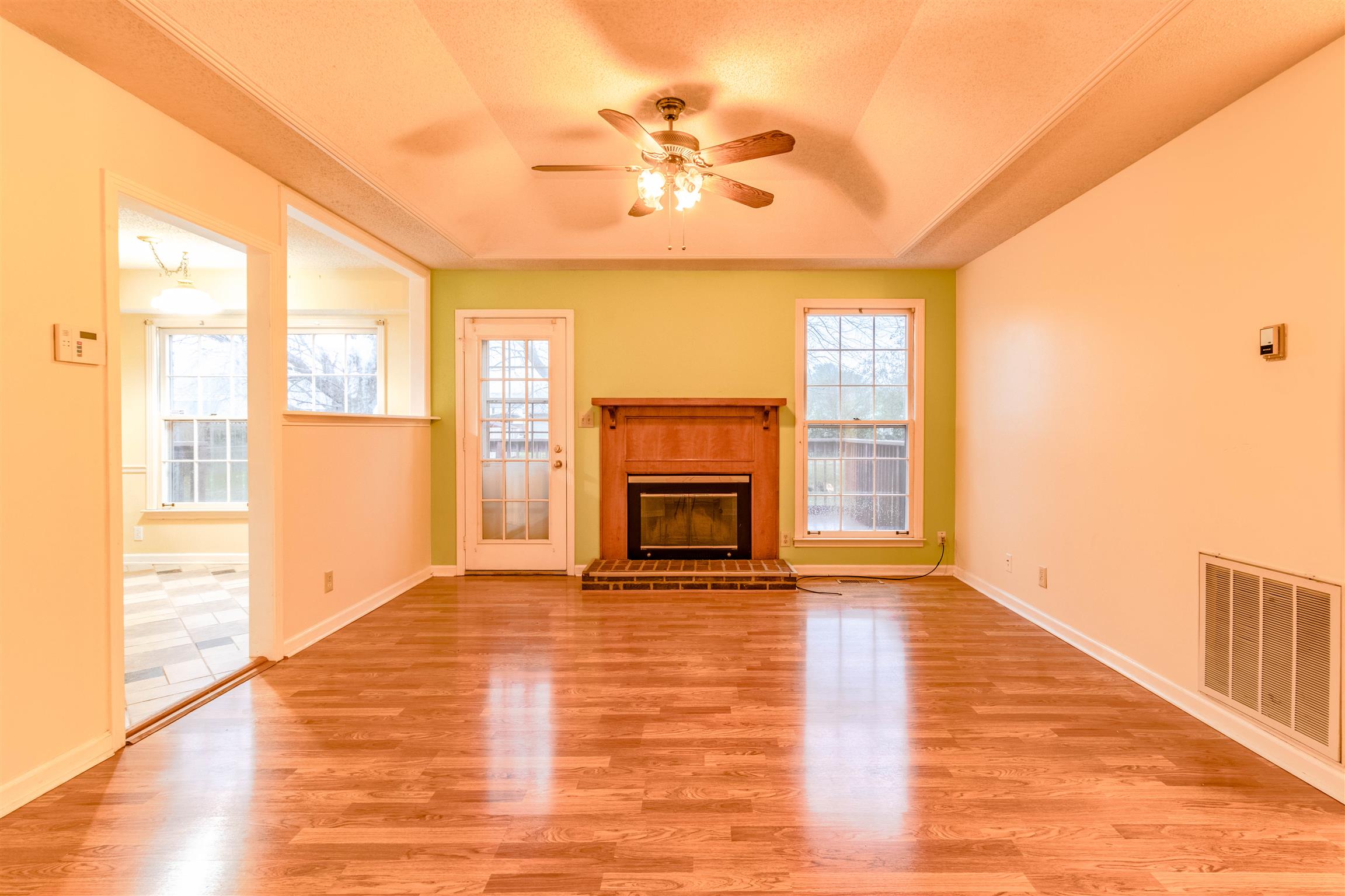 3411 Polly Drive Clarksville, TN 37042 - Photo 5 of 20 a view of empty room with a fireplace and wooden floor