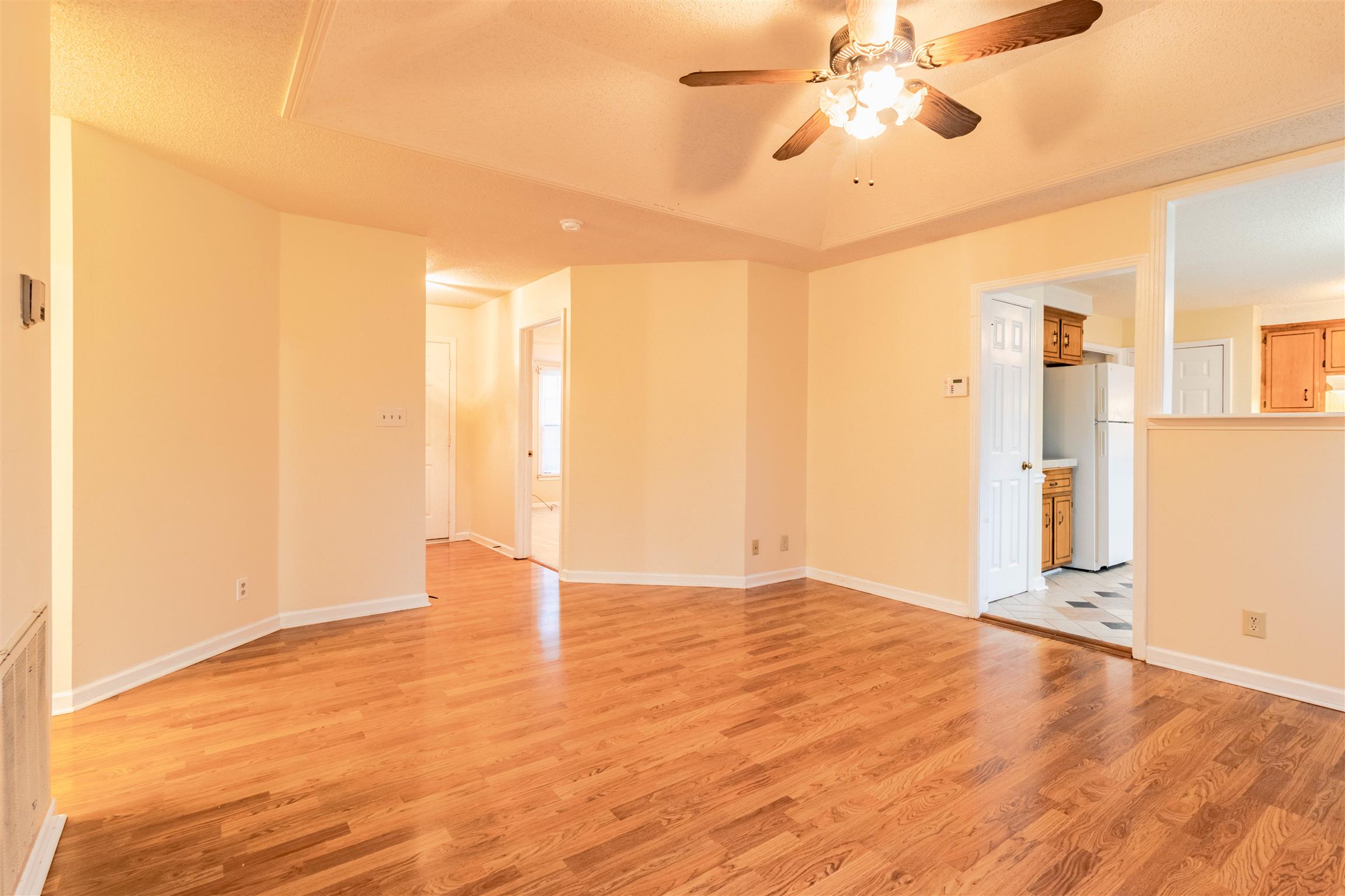 3411 Polly Drive Clarksville, TN 37042 - Photo 6 of 20 an empty room with wooden floor and windows