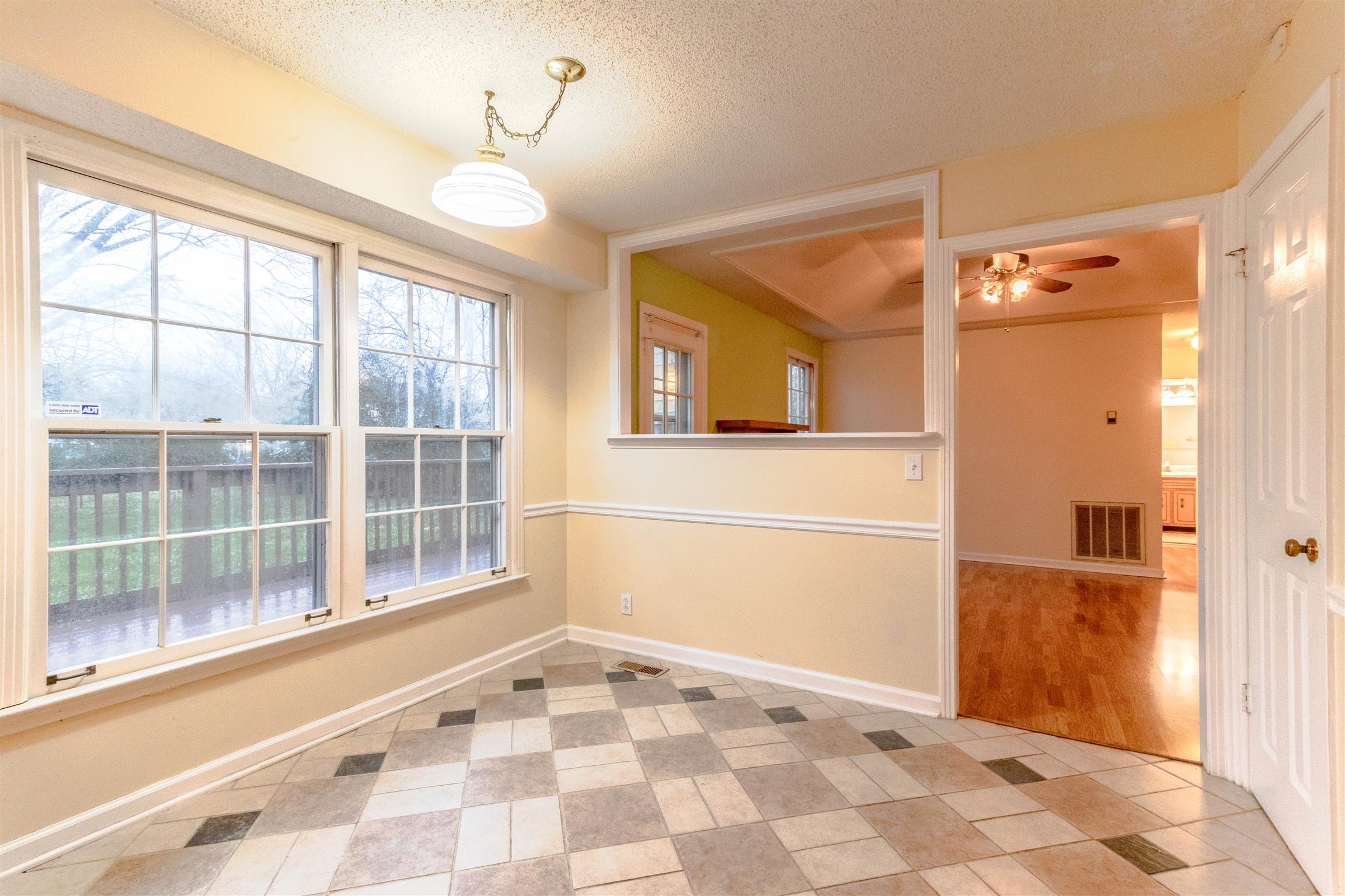 3411 Polly Drive Clarksville, TN 37042 - Photo 9 of 20 a view of a hallway with windows and chandelier
