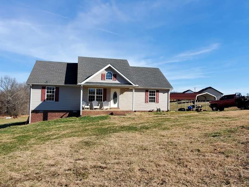 573 Womack Road Bethpage, TN 37022 - Photo 2 of 21 a front view of a house with a yard