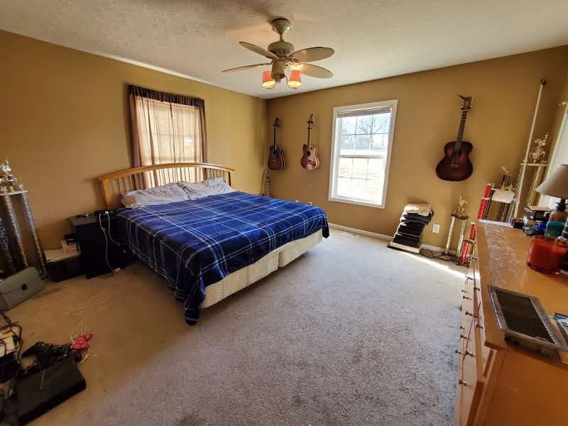 573 Womack Road Bethpage, TN 37022 - Photo 18 of 21 a bedroom with a bed and window