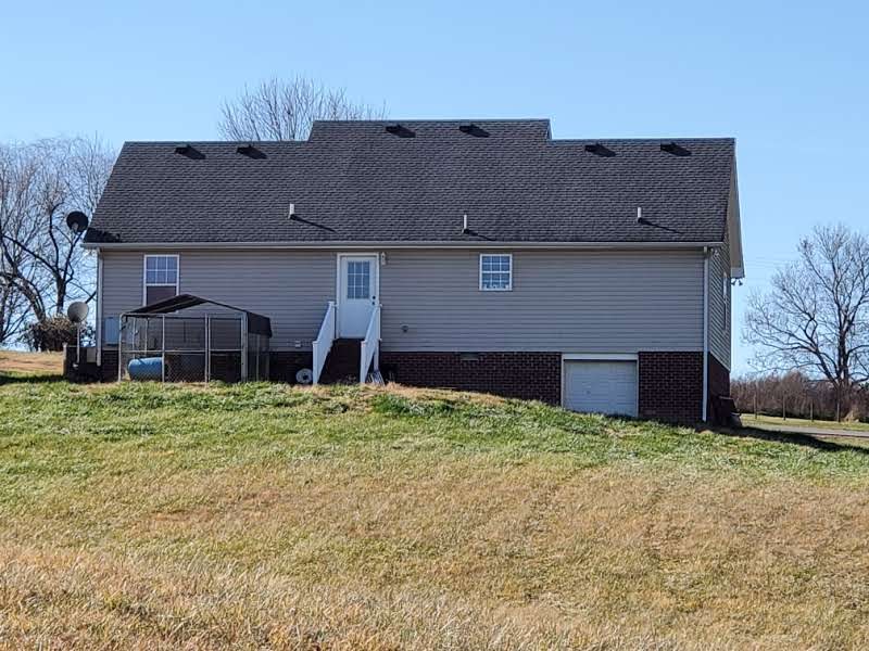 573 Womack Road Bethpage, TN 37022 - Photo 21 of 21 front view of a house with a yard