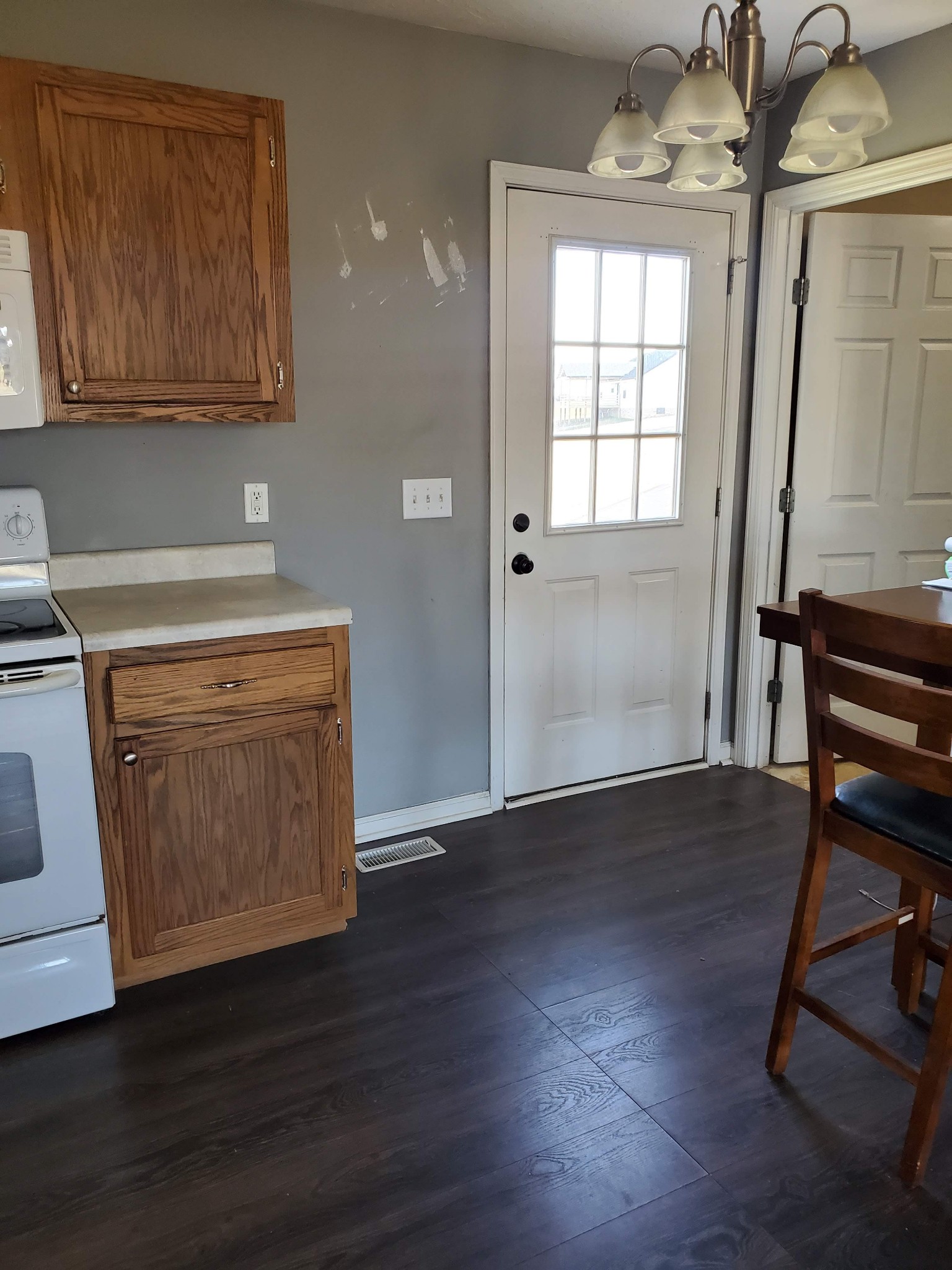 573 Womack Road Bethpage, TN 37022 - Photo 6 of 21 an empty room with wooden floor and windows