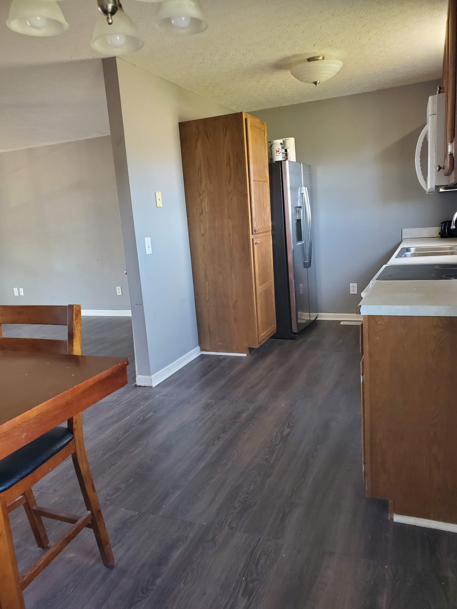 573 Womack Road Bethpage, TN 37022 - Photo 7 of 21 a view of a hallway with wooden floor and staircase