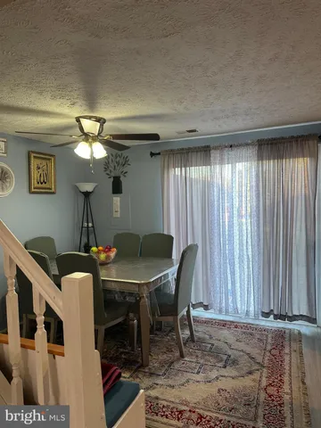 a view of a livingroom with furniture and window