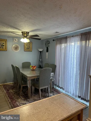 a dinning table and chairs in a room