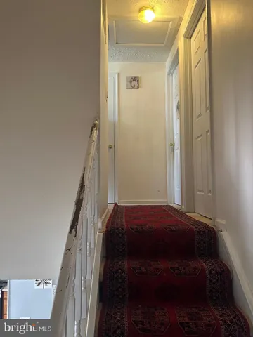 a bedroom with a bed and a mirror