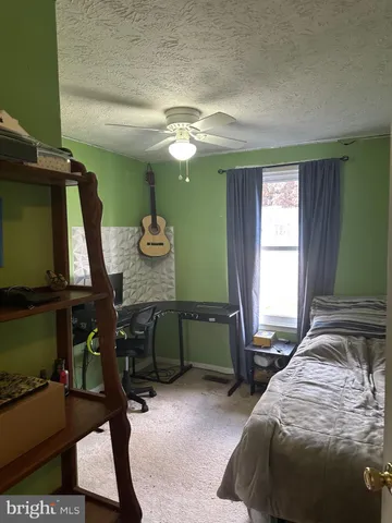a bathroom with a toilet sink and a mirror