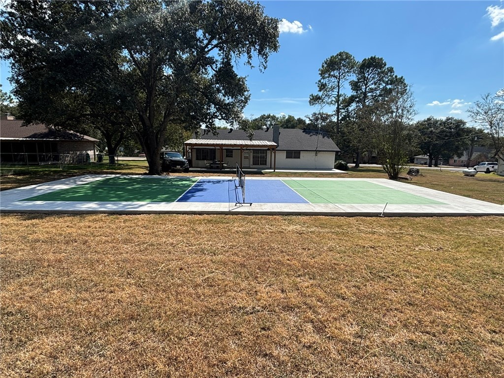 2004 Pinewood Drive Bryan, TX 77807 - Photo 12 of 12 a view of pool and trees in the background