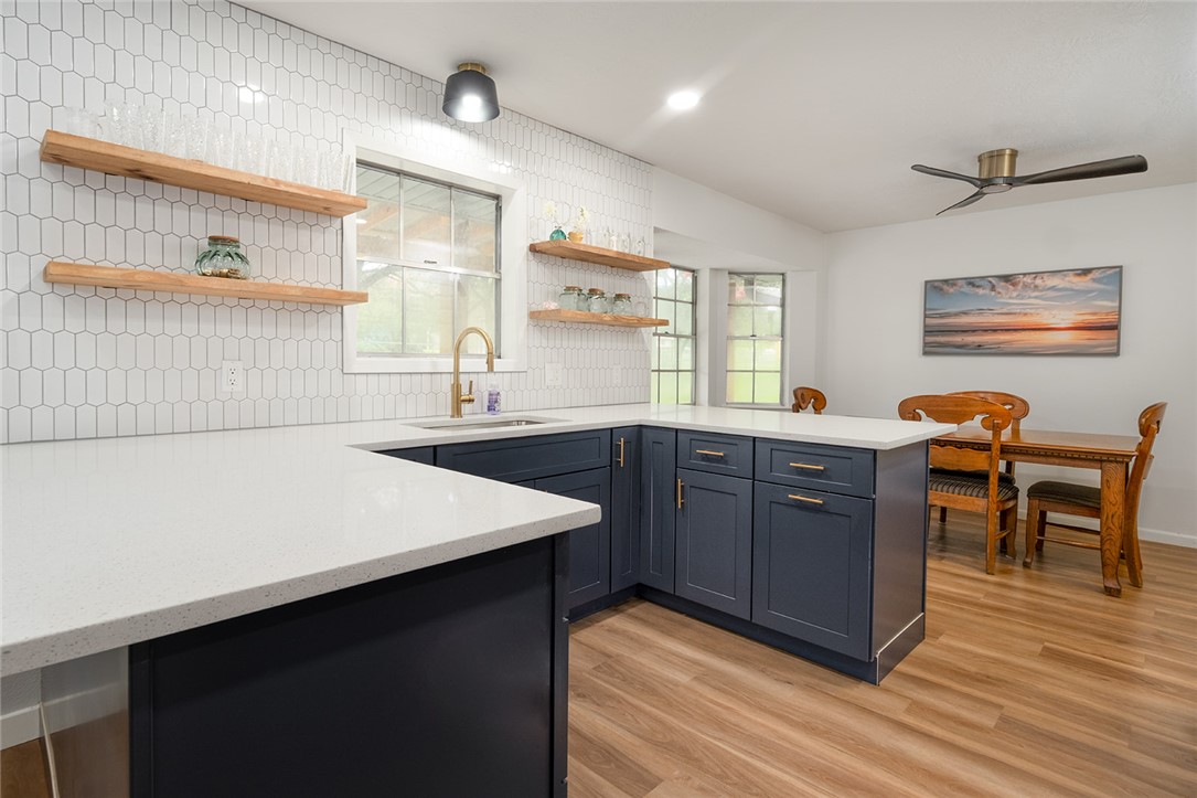 2004 Pinewood Drive Bryan, TX 77807 - Photo 4 of 12 a kitchen with a wooden table and chairs