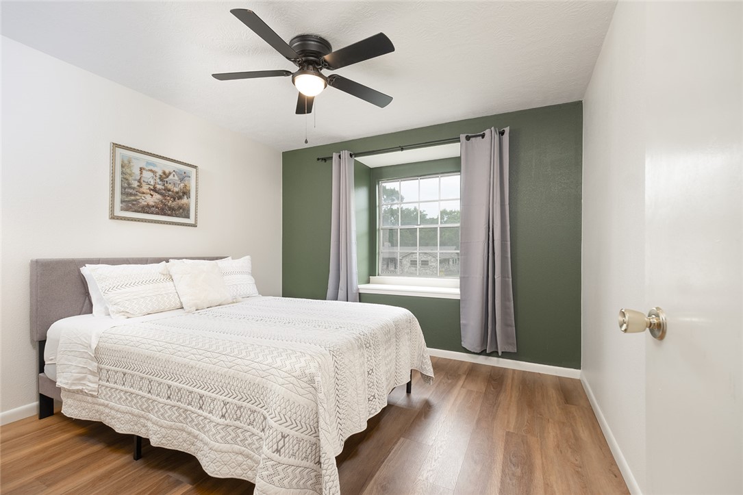 2004 Pinewood Drive Bryan, TX 77807 - Photo 5 of 12 a bedroom with a large bed and a window