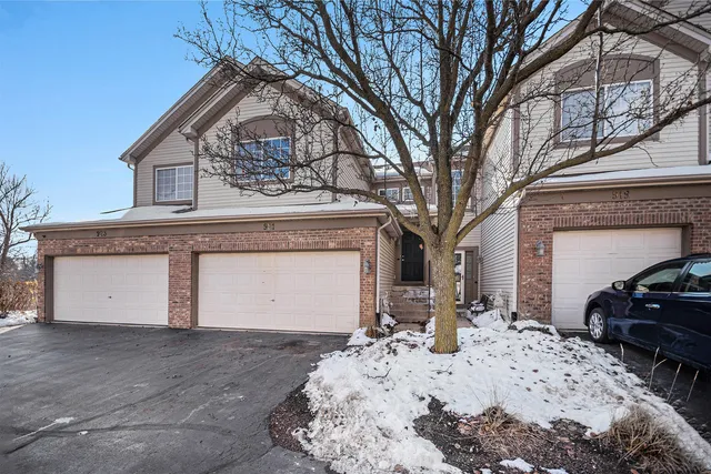 a view of a house with a snow in front of house