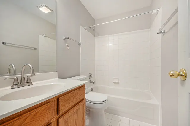 a bathroom with a sink a toilet and a bathtub