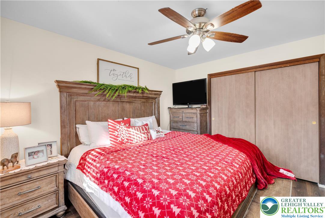 501 Creek Road Bath, PA 18014 - Photo 18 of 50 a bedroom with a bed and a flat screen tv