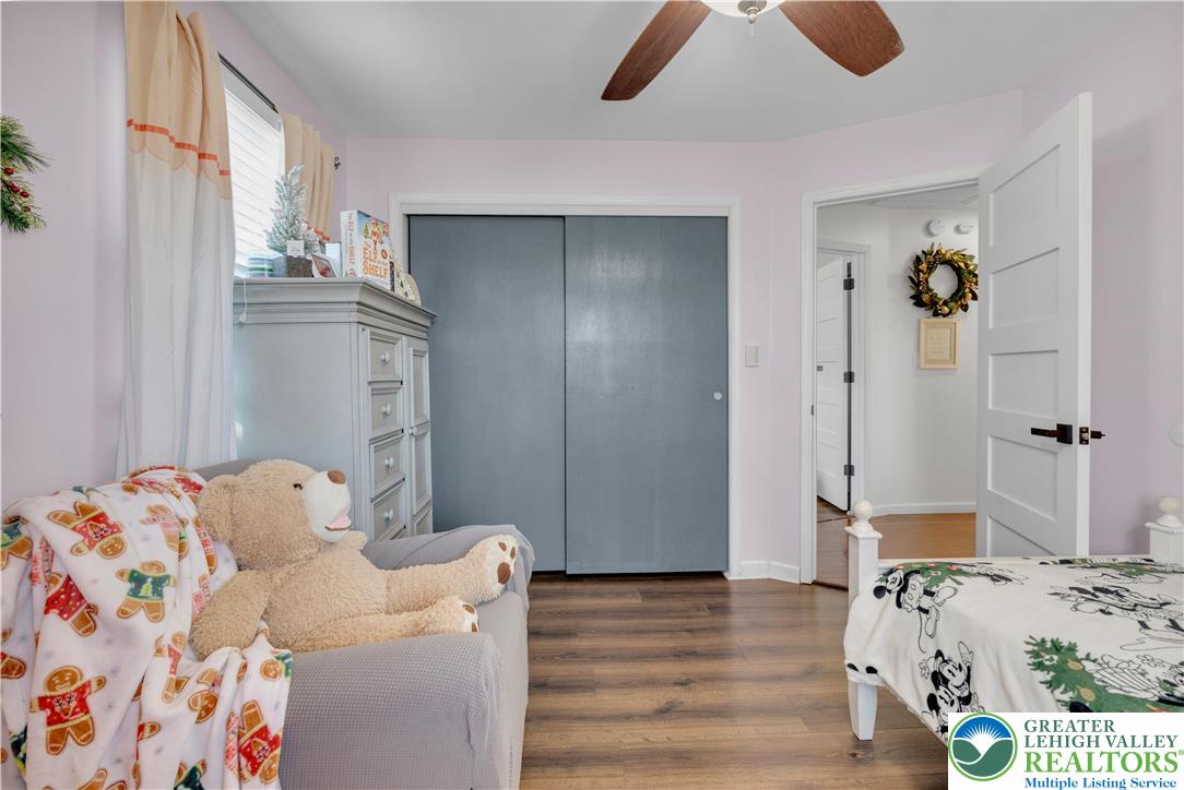 501 Creek Road Bath, PA 18014 - Photo 21 of 50 a bedroom with a bed and wooden floor