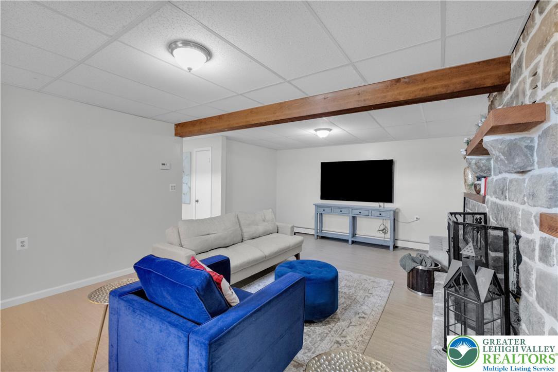 501 Creek Road Bath, PA 18014 - Photo 27 of 50 a living room with furniture and a flat screen tv