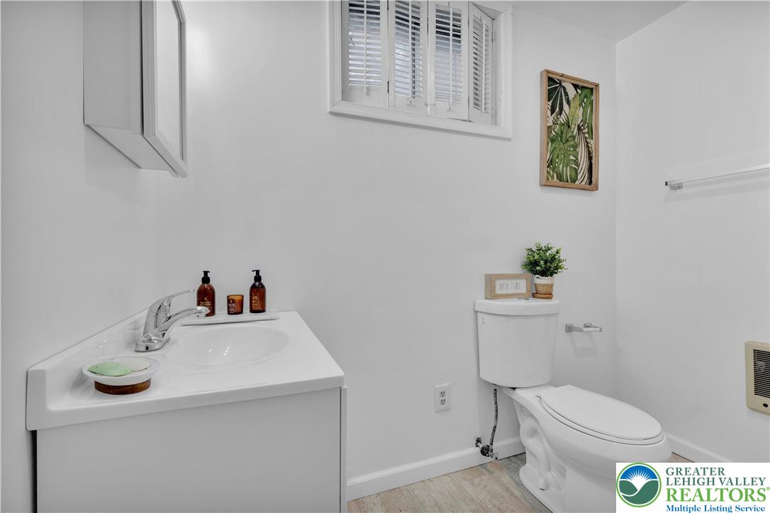501 Creek Road Bath, PA 18014 - Photo 32 of 50 a white toilet sitting next to a bathroom sink